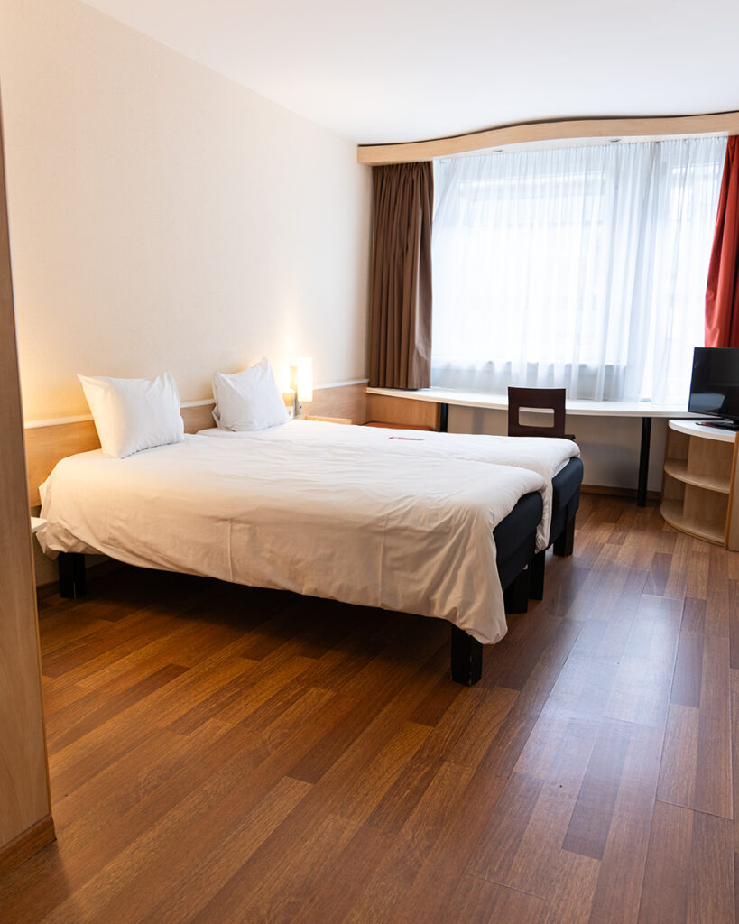 Room at Ibis Budget Hotel in Budapest with bed, pillows, window and simple interior